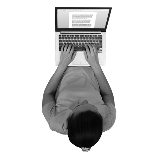 a man typing on a laptop
